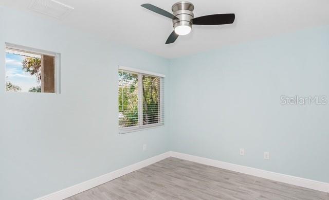 9471-9473 Agate St, Port Charlotte, FL 33981 - unfurnished room featuring light wood-type flooring and ceiling fan