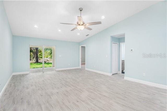 9471-9473 Agate St, Port Charlotte, FL 33981 - unfurnished room with vaulted ceiling, light wood finished floors, a ceiling fan, and recessed lighting