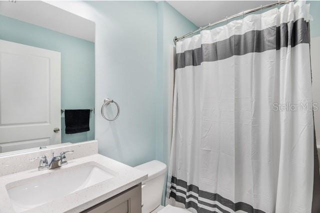 9471-9473 Agate St, Port Charlotte, FL 33981 - bathroom featuring vanity and a shower with curtain