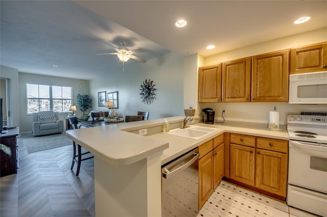 2090 Matecumbe Key Rd Unit 1202, Punta Gorda, FL 33955 - kitchen with white appliances, a peninsula, open floor plan, ceiling fan, and light countertops