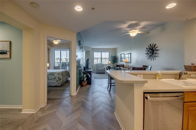 2090 Matecumbe Key Rd Unit 1202, Punta Gorda, FL 33955 - kitchen with stainless steel dishwasher, a ceiling fan, open floor plan, recessed lighting, and light countertops