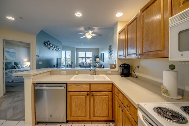 2090 Matecumbe Key Rd Unit 1202, Punta Gorda, FL 33955 - kitchen featuring dishwasher, white microwave, a peninsula, a ceiling fan, and open floor plan