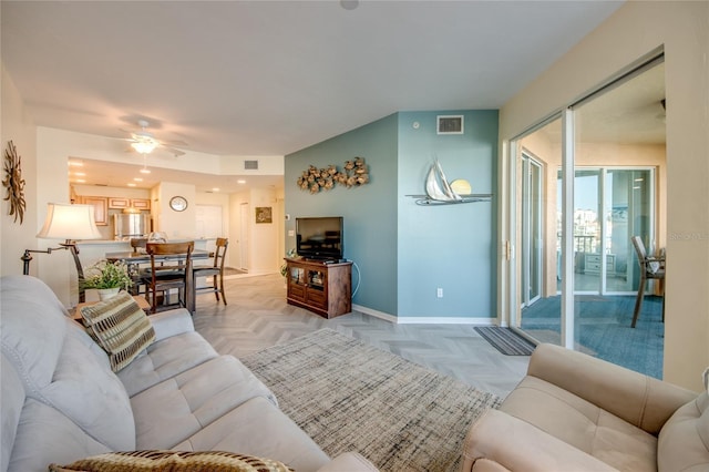 2090 Matecumbe Key Rd Unit 1202, Punta Gorda, FL 33955 - living area with ceiling fan and baseboards
