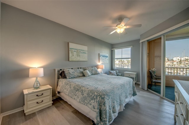 2090 Matecumbe Key Rd Unit 1202, Punta Gorda, FL 33955 - bedroom featuring light wood finished floors, access to exterior, and ceiling fan