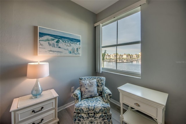 2090 Matecumbe Key Rd Unit 1202, Punta Gorda, FL 33955 - living area with healthy amount of natural light, a water view, and wood finished floors
