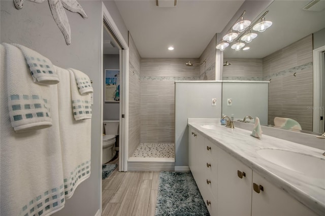 2090 Matecumbe Key Rd Unit 1202, Punta Gorda, FL 33955 - bathroom with walk in shower, double vanity, and recessed lighting