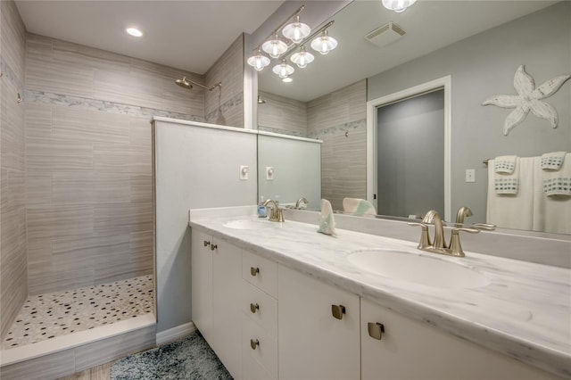 2090 Matecumbe Key Rd Unit 1202, Punta Gorda, FL 33955 - bathroom with walk in shower, double vanity, and recessed lighting