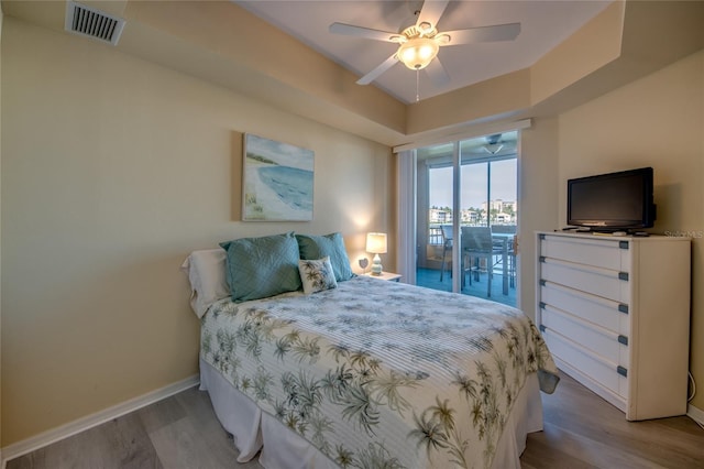 2090 Matecumbe Key Rd Unit 1202, Punta Gorda, FL 33955 - bedroom with wood finished floors and a ceiling fan