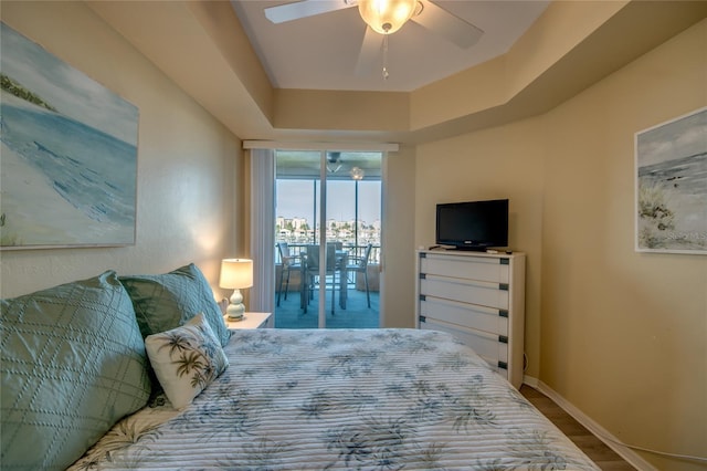 2090 Matecumbe Key Rd Unit 1202, Punta Gorda, FL 33955 - bedroom with access to outside, wood finished floors, and a ceiling fan
