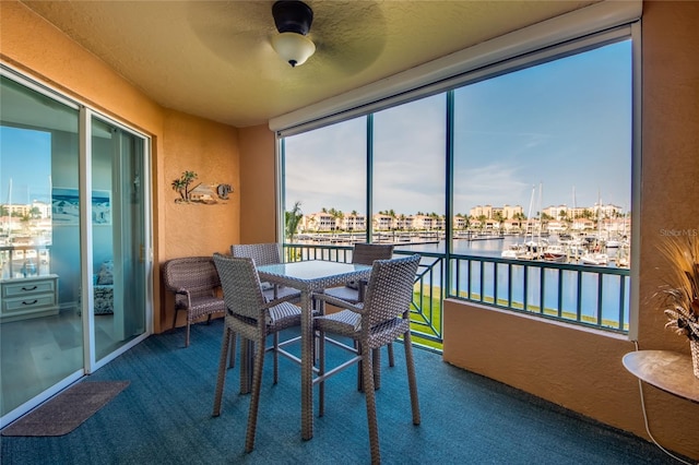 2090 Matecumbe Key Rd Unit 1202, Punta Gorda, FL 33955 - sunroom / solarium featuring a water view and a textured wall