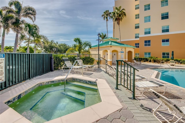 2090 Matecumbe Key Rd Unit 1202, Punta Gorda, FL 33955 - community pool featuring a hot tub and a patio area