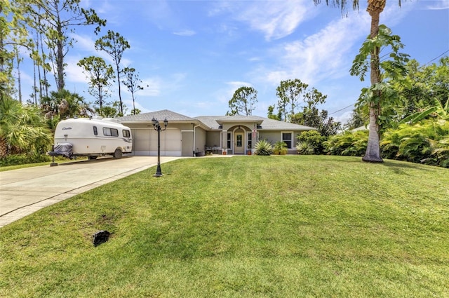 1445 Gauguin Rd, North Port, FL 34288 - single story home featuring concrete driveway, a garage, a front yard, and stucco siding