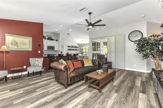 1445 Gauguin Rd, North Port, FL 34288 - living room with ceiling fan, wood finished floors, lofted ceiling, and recessed lighting