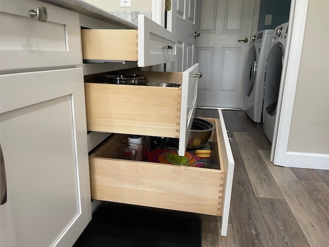 1445 Gauguin Rd, North Port, FL 34288 - kitchen featuring separate washer and dryer and dark wood finished floors