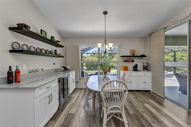 1445 Gauguin Rd, North Port, FL 34288 - kitchen featuring open shelves, beverage cooler, white cabinetry, and healthy amount of natural light