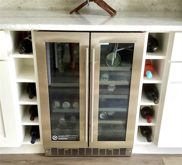 1445 Gauguin Rd, North Port, FL 34288 - kitchen view of wine cooler and wood finished floors