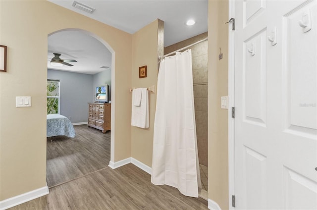 1445 Gauguin Rd, North Port, FL 34288 - corridor featuring arched walkways and wood finished floors