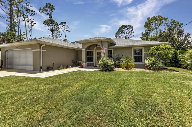 1445 Gauguin Rd, North Port, FL 34288 - view of front of house featuring stucco siding, an attached garage, a front lawn, and concrete driveway