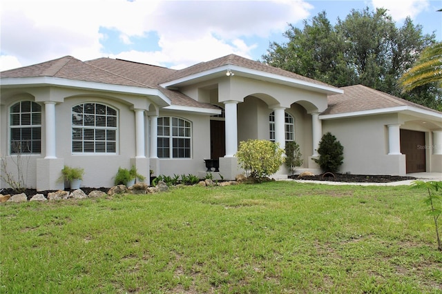 8039 Agate St, Port Charlotte, FL 33981 - view of front of property with a garage, stucco siding, a front lawn, and roof with shingles