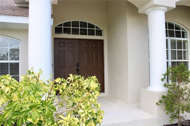 8039 Agate St, Port Charlotte, FL 33981 - property entrance featuring stucco siding