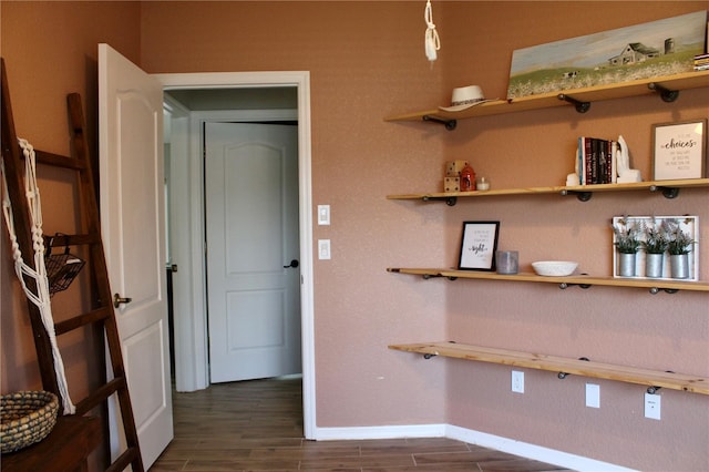 8039 Agate St, Port Charlotte, FL 33981 - hallway with baseboards and dark wood-style floors