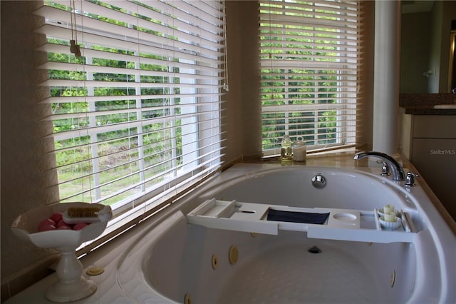 8039 Agate St, Port Charlotte, FL 33981 - bathroom with a whirlpool tub and vanity