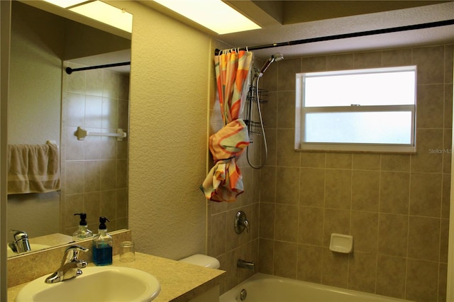 8039 Agate St, Port Charlotte, FL 33981 - bathroom featuring a textured wall, shower / bath combo, and vanity