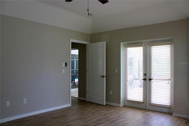 8039 Agate St, Port Charlotte, FL 33981 - spare room with ceiling fan, french doors, wood finished floors, and a smoke detector