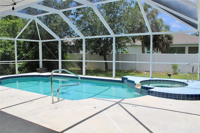 8039 Agate St, Port Charlotte, FL 33981 - view of pool with a pool with connected hot tub, a patio area, and glass enclosure