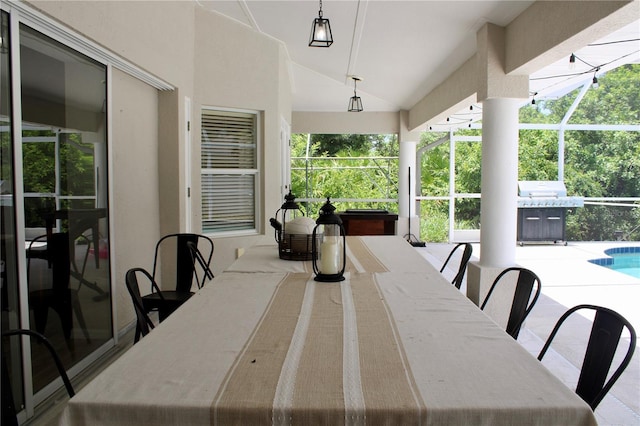 8039 Agate St, Port Charlotte, FL 33981 - view of patio / terrace with outdoor dining area, an outdoor pool, glass enclosure, and a grill