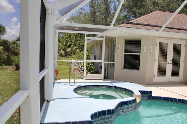 8039 Agate St, Port Charlotte, FL 33981 - view of swimming pool featuring french doors, a pool with connected hot tub, a patio, and glass enclosure