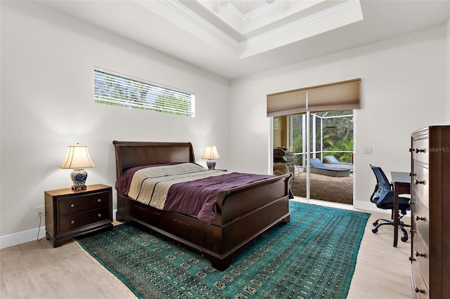 2453 Harbour Dr, Punta Gorda, FL 33983 - bedroom featuring access to outside, ornamental molding, an office area, a raised ceiling, and wood finished floors