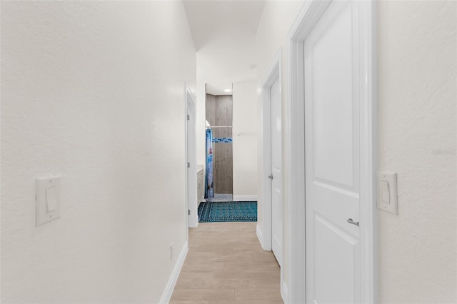 2453 Harbour Dr, Punta Gorda, FL 33983 - hallway with light wood-type flooring and a textured wall