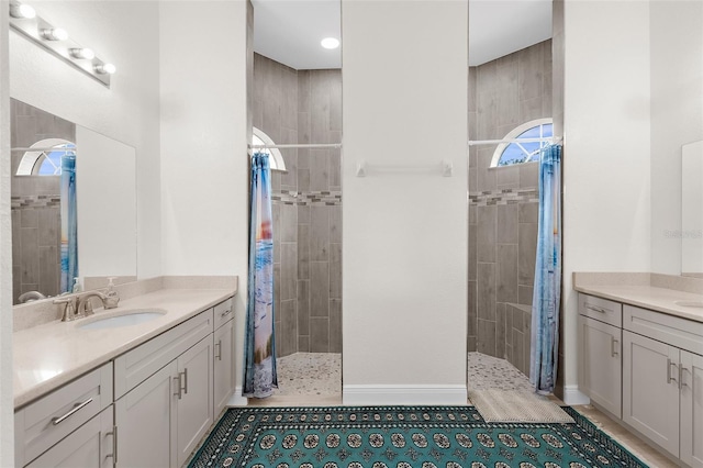 2453 Harbour Dr, Punta Gorda, FL 33983 - full bath featuring walk in shower, two vanities, and tile patterned flooring