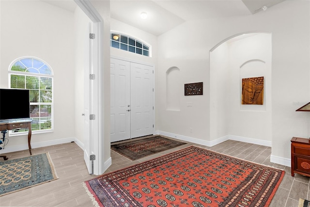 2453 Harbour Dr, Punta Gorda, FL 33983 - entryway with wood tiled floors, arched walkways, and lofted ceiling