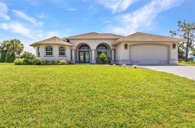 771 Rotonda Cir, Rotonda West, FL 33947 - mediterranean / spanish house with french doors, stucco siding, driveway, and a front yard