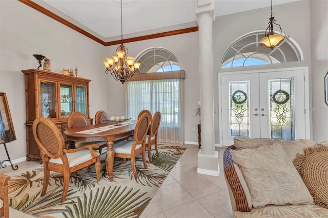 771 Rotonda Cir, Rotonda West, FL 33947 - dining area with a chandelier, french doors, light tile patterned floors, and decorative columns