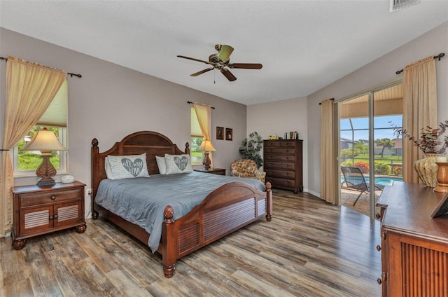 771 Rotonda Cir, Rotonda West, FL 33947 - bedroom featuring access to exterior, wood finished floors, and a ceiling fan