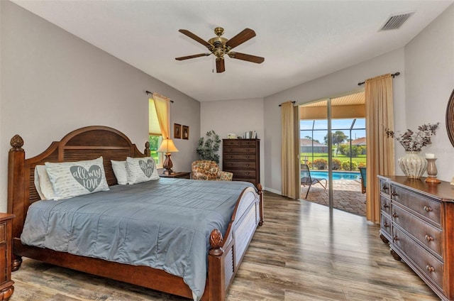 771 Rotonda Cir, Rotonda West, FL 33947 - bedroom featuring wood finished floors, access to exterior, and ceiling fan