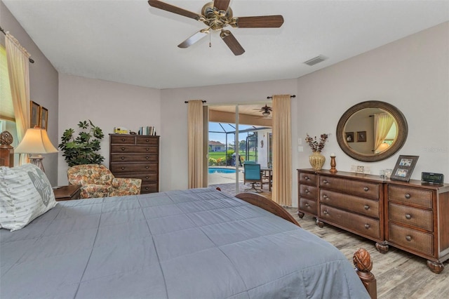 771 Rotonda Cir, Rotonda West, FL 33947 - bedroom with access to exterior, wood finished floors, and ceiling fan