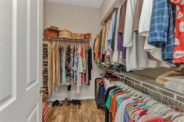 771 Rotonda Cir, Rotonda West, FL 33947 - walk in closet with wood finished floors