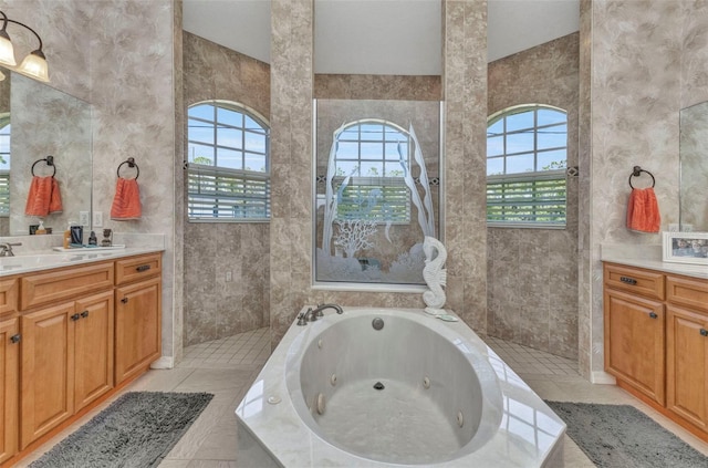 771 Rotonda Cir, Rotonda West, FL 33947 - full bath featuring vanity, a jetted tub, tile walls, and a walk in shower