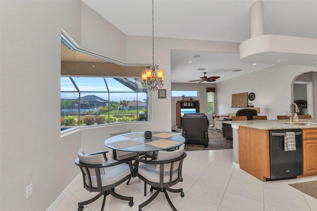 771 Rotonda Cir, Rotonda West, FL 33947 - dining room with a ceiling fan, a chandelier, and light tile patterned flooring