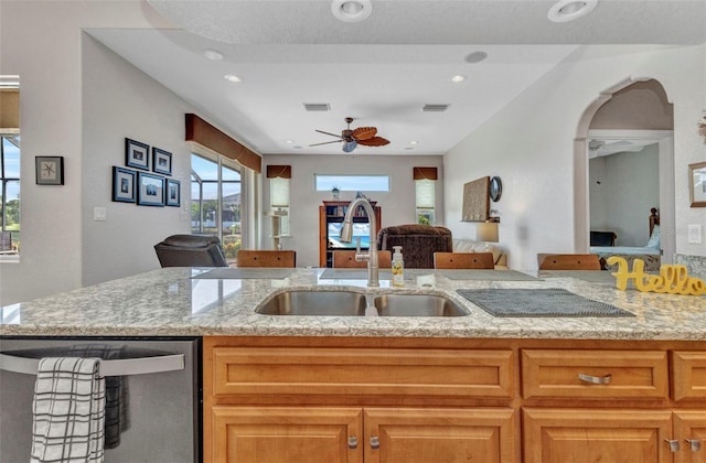 771 Rotonda Cir, Rotonda West, FL 33947 - kitchen with open floor plan, dishwasher, light stone counters, ceiling fan, and recessed lighting