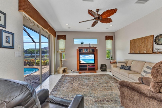 771 Rotonda Cir, Rotonda West, FL 33947 - living room with plenty of natural light, ceiling fan, tile patterned flooring, and recessed lighting