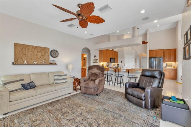 771 Rotonda Cir, Rotonda West, FL 33947 - living area with arched walkways, ceiling fan, and recessed lighting