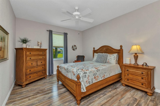 771 Rotonda Cir, Rotonda West, FL 33947 - bedroom with wood finished floors and ceiling fan