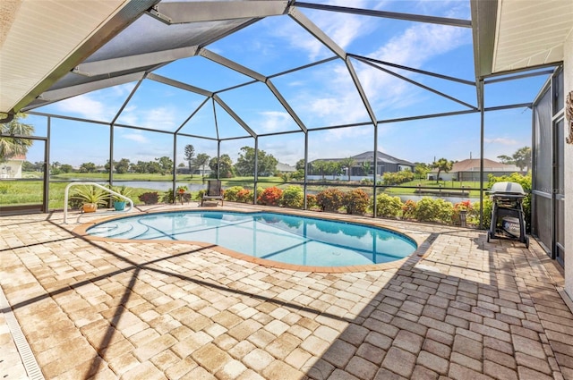 771 Rotonda Cir, Rotonda West, FL 33947 - outdoor pool with grilling area, a patio area, glass enclosure, and a water view