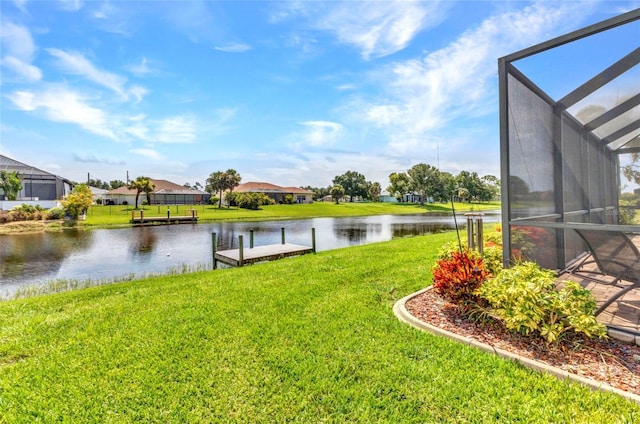771 Rotonda Cir, Rotonda West, FL 33947 - view of grassy yard with a water view, a boat dock, a residential view, and a lanai