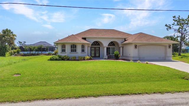771 Rotonda Cir, Rotonda West, FL 33947 - mediterranean / spanish-style home with french doors, stucco siding, a front lawn, a garage, and concrete driveway